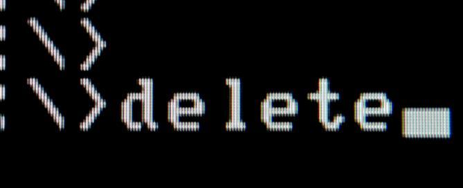 a black background image with the word delete in white text