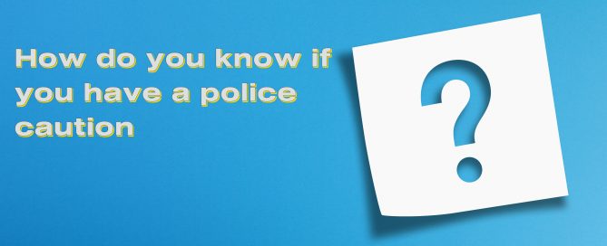 blue background with words How do you know if you have a police caution and a large white question mark