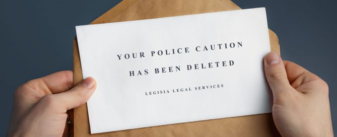a man opening an envelope with a message inside saying your Police Caution has been deleted legisia legal services
