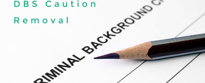 DBS Caution Removal witten on a criminal record background check form with a pencil on it, with Legisia logo on the bottom left